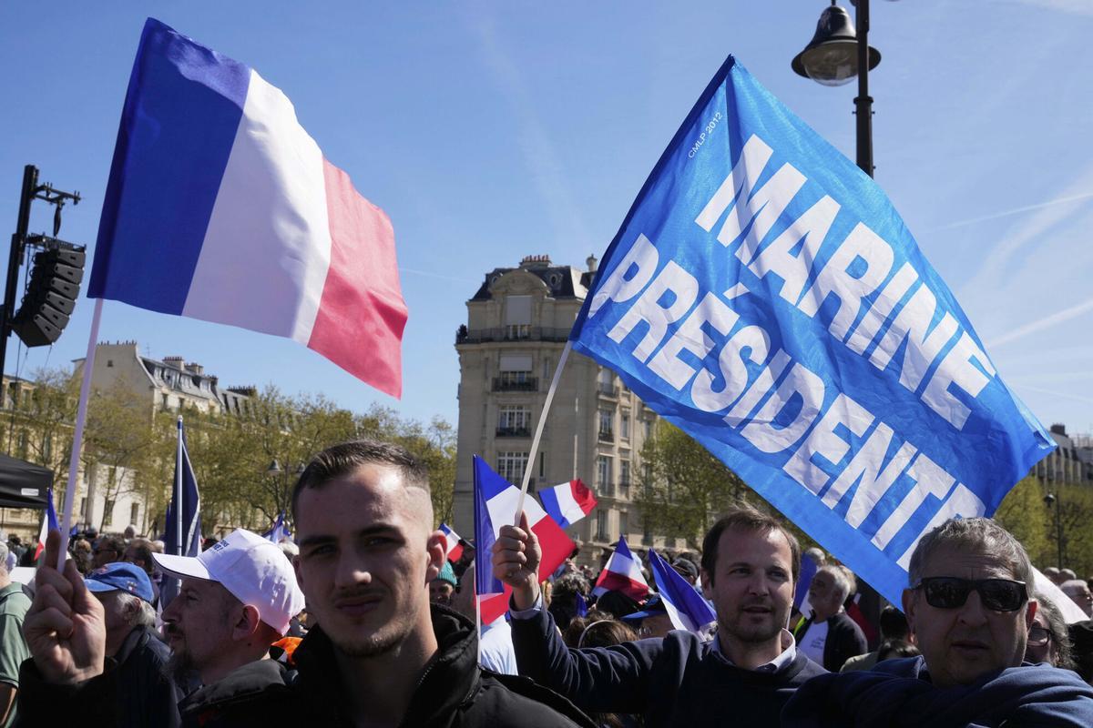 People attend at the French far-right party national rally near the parliament in support of Marine Le Pen, in Paris, Sunday, April 6, 2025. (AP Photo/Michel Euler). EDITORIAL USE ONLY/ONLY ITALY AND SPAIN